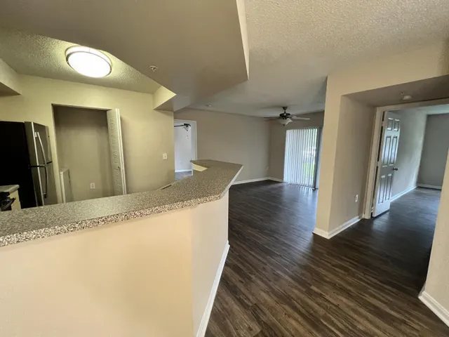 a view of a kitchen cabinets and wooden floor