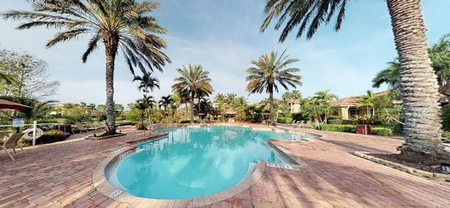 an ocean view with a swimming pool and furniture