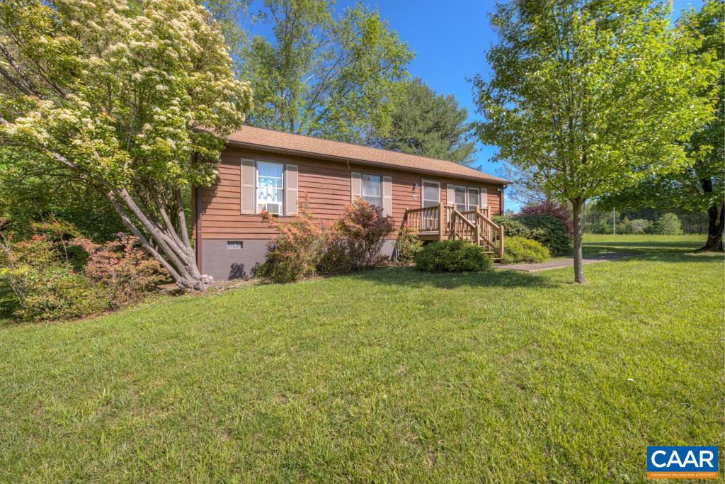 2475 Ridge Road Palmyra, VA 22963 - Photo 22 of 25 a view of a backyard with plants and large tree