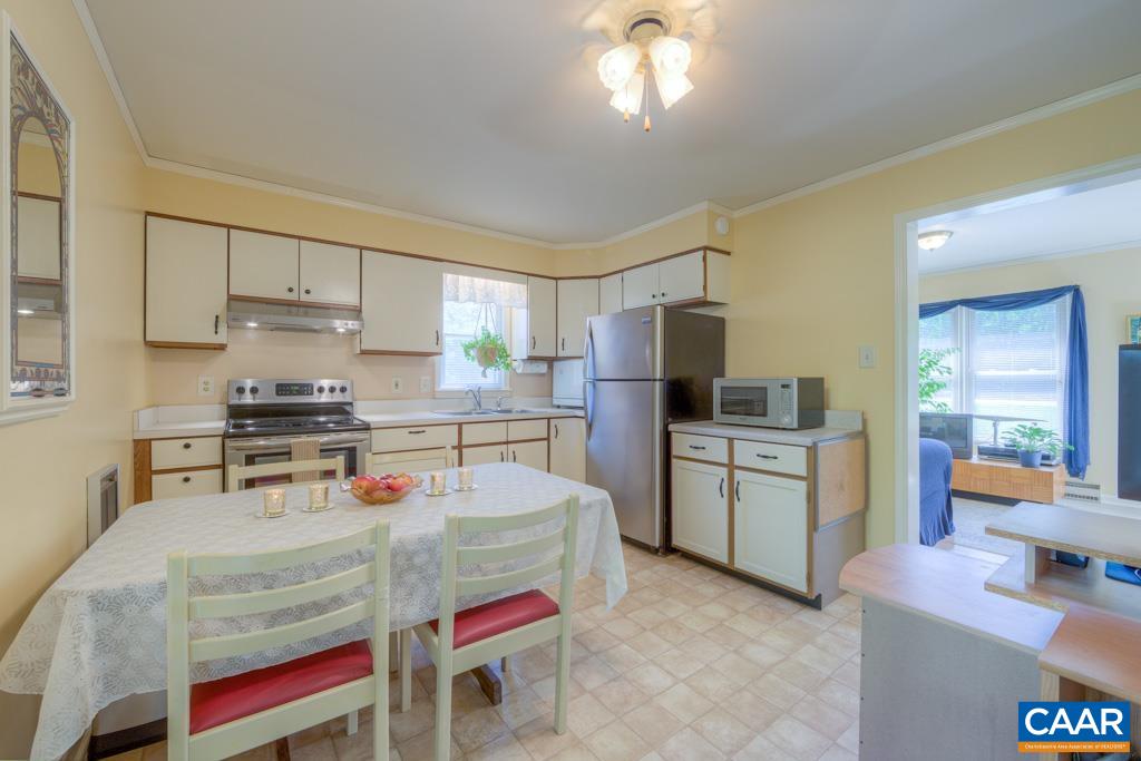 2475 Ridge Road Palmyra, VA 22963 - Photo 6 of 25 a kitchen with a refrigerator and a stove top oven