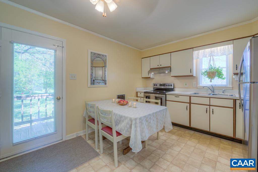 2475 Ridge Road Palmyra, VA 22963 - Photo 8 of 25 a kitchen with a sink stove and microwave