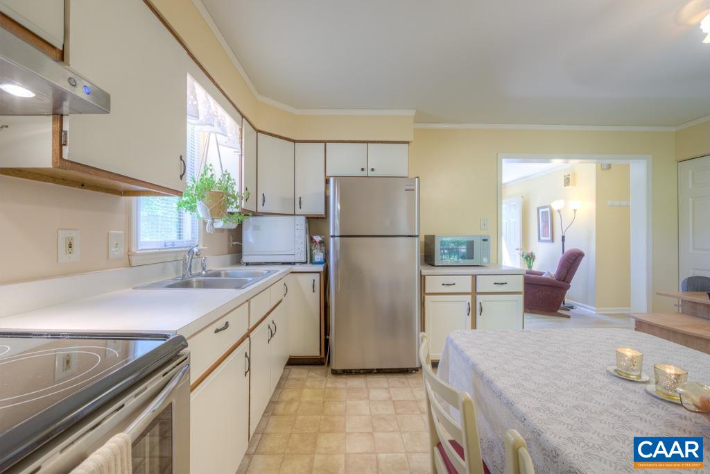 2475 Ridge Road Palmyra, VA 22963 - Photo 9 of 25 a kitchen with a sink a refrigerator and a stove top oven