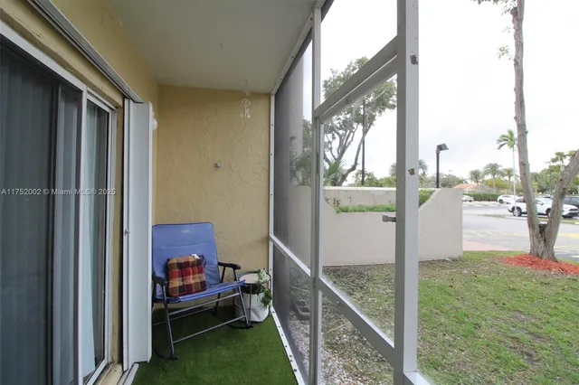 a view of balcony and yard
