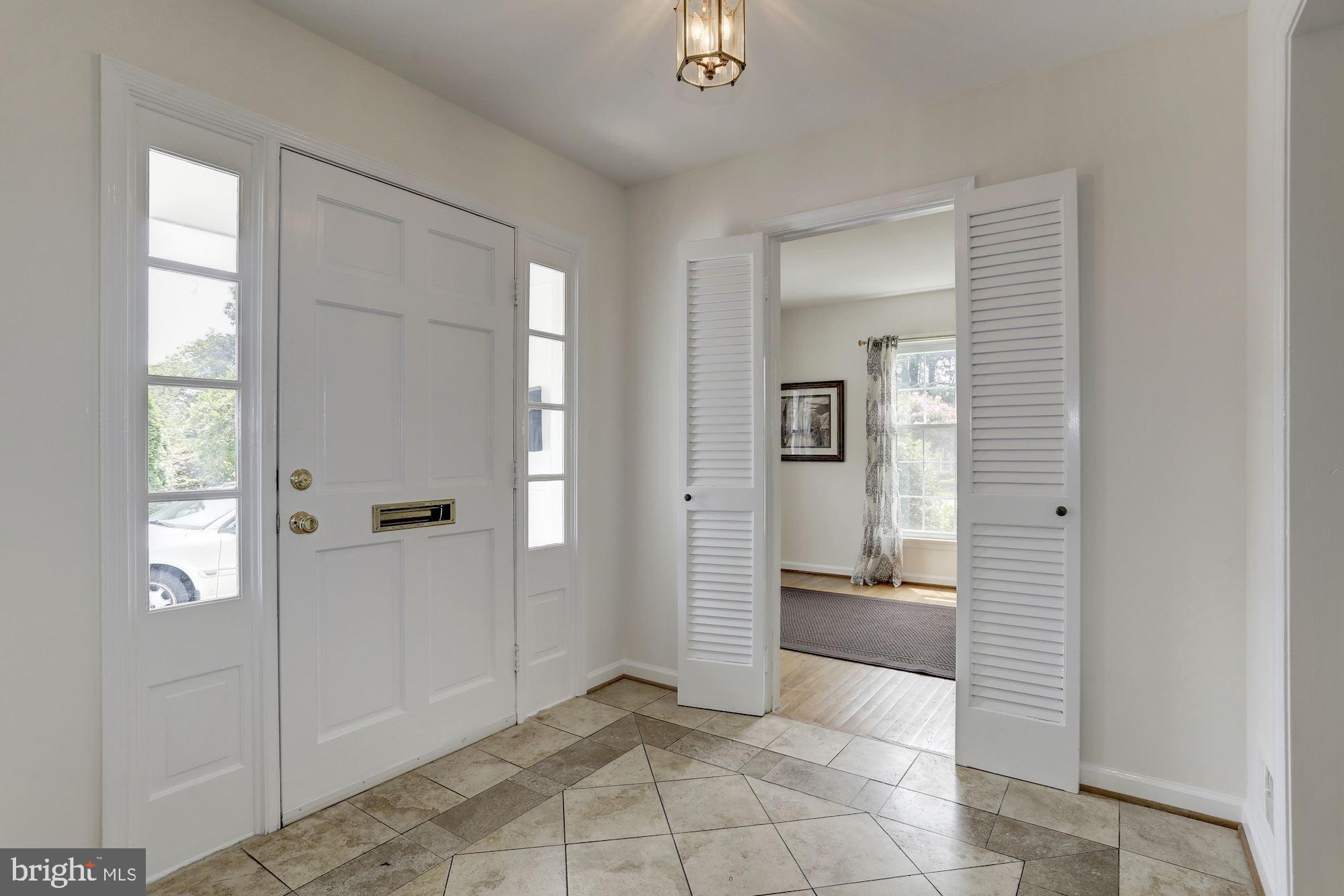 10239 Gainsborough Road Potomac, MD 20854 - Photo 3 of 21 wooden floor with a bathroom and a sink
