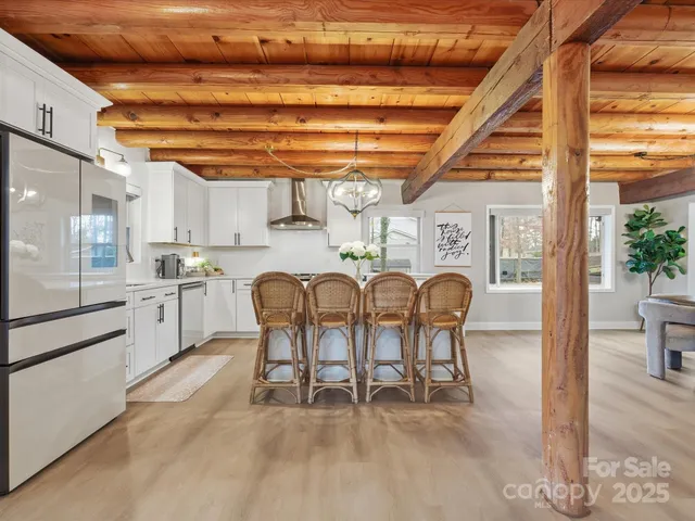 a kitchen with furniture and a window