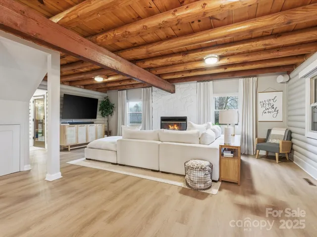 a living room with furniture and a flat screen tv