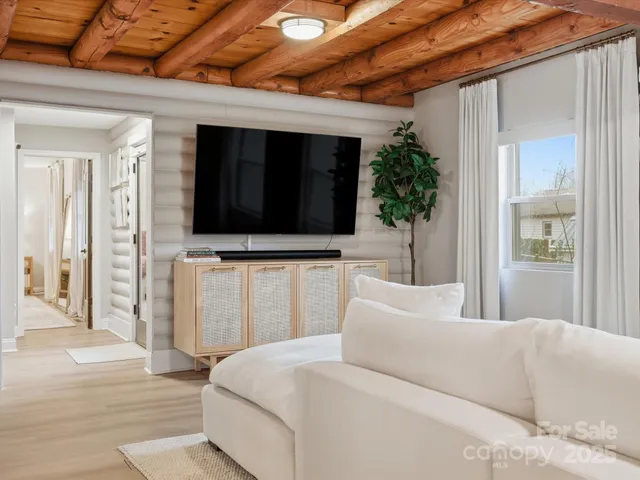 a living room with a couch and a flat screen tv