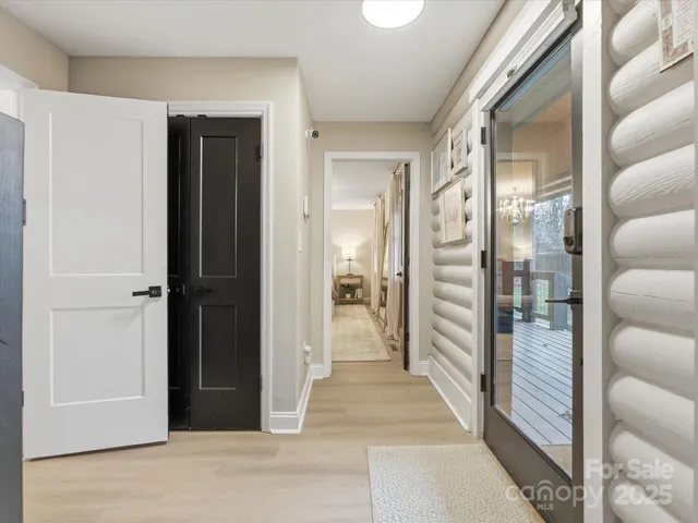 a view of a hallway with a living room
