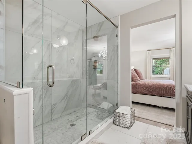 a en suite bathroom with a shower and sink