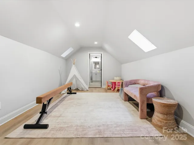 a room with gym equipment and a rug