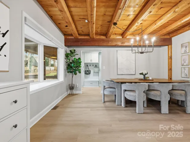 a dining room with furniture and window