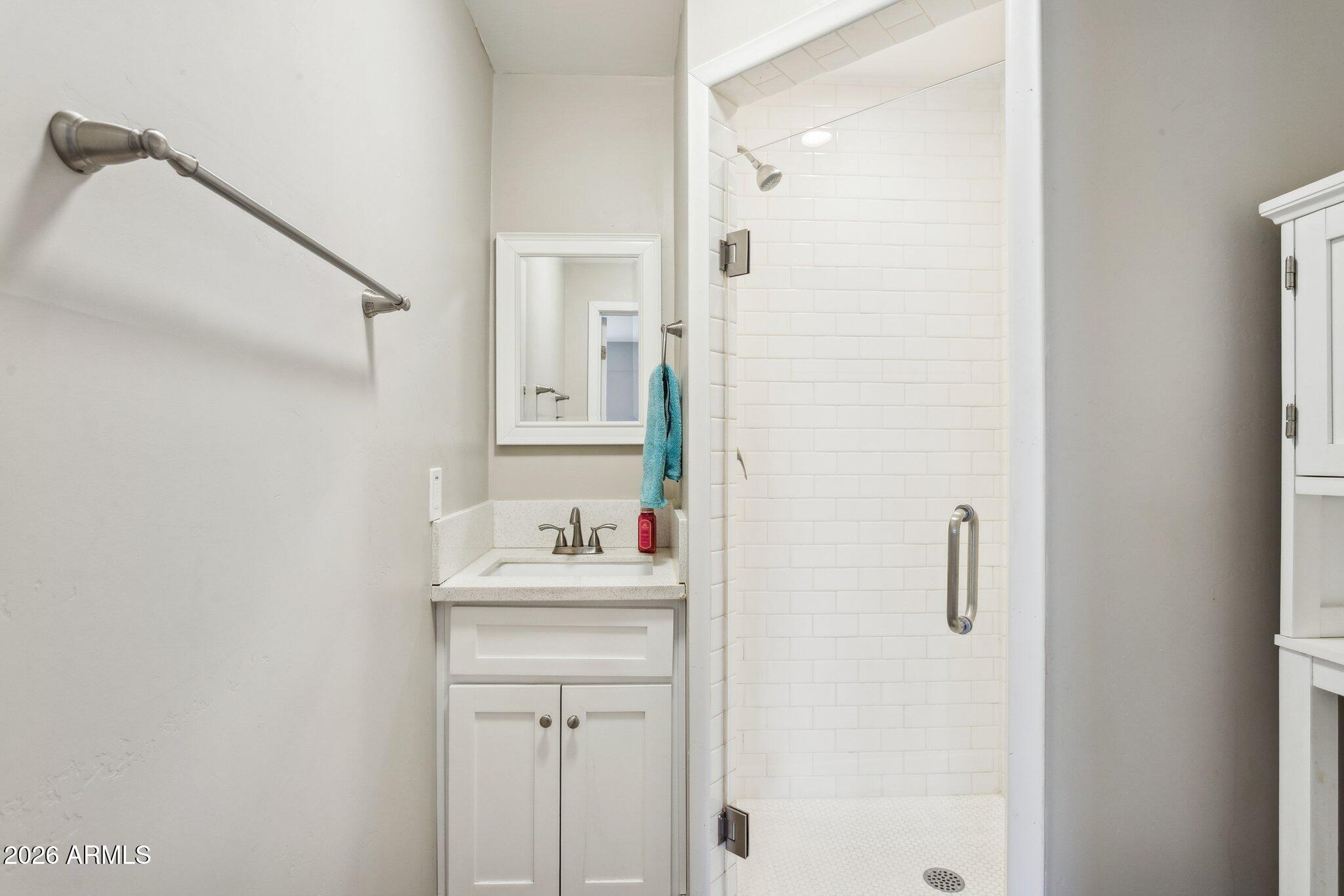322 West Coronado Road Phoenix, AZ 85003 - Photo 32 of 93 a bathroom with a sink mirror and vanity