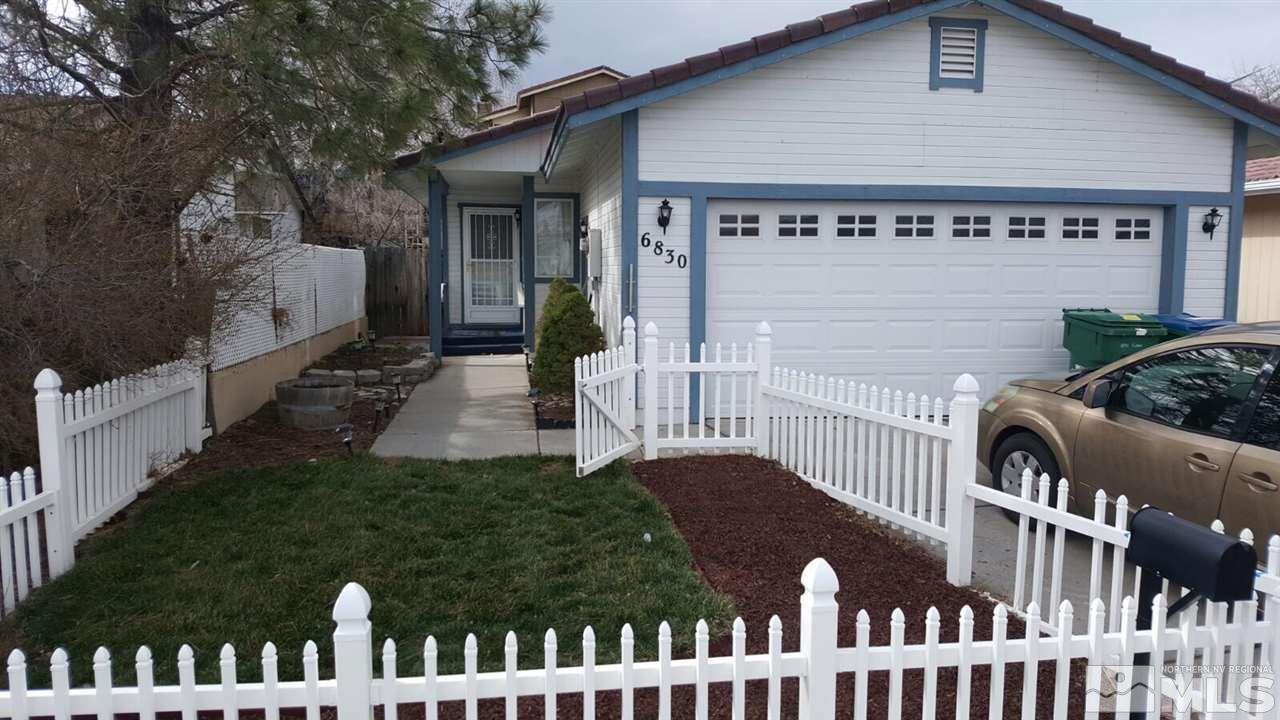 6830 Flower Street Reno, NV 89506 - Photo 1 of 1 a front view of a house with garden