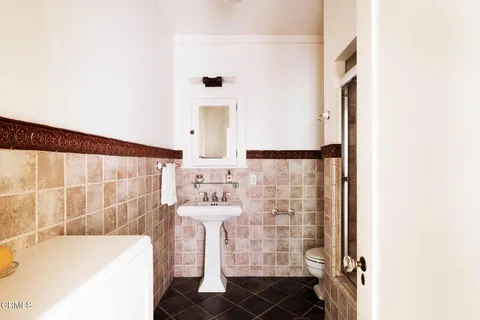 a bathroom with a bathtub and shower