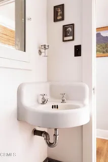 a bath tub sitting next to a white sink