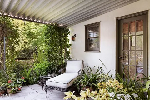 a view of a chairs and table in a patio