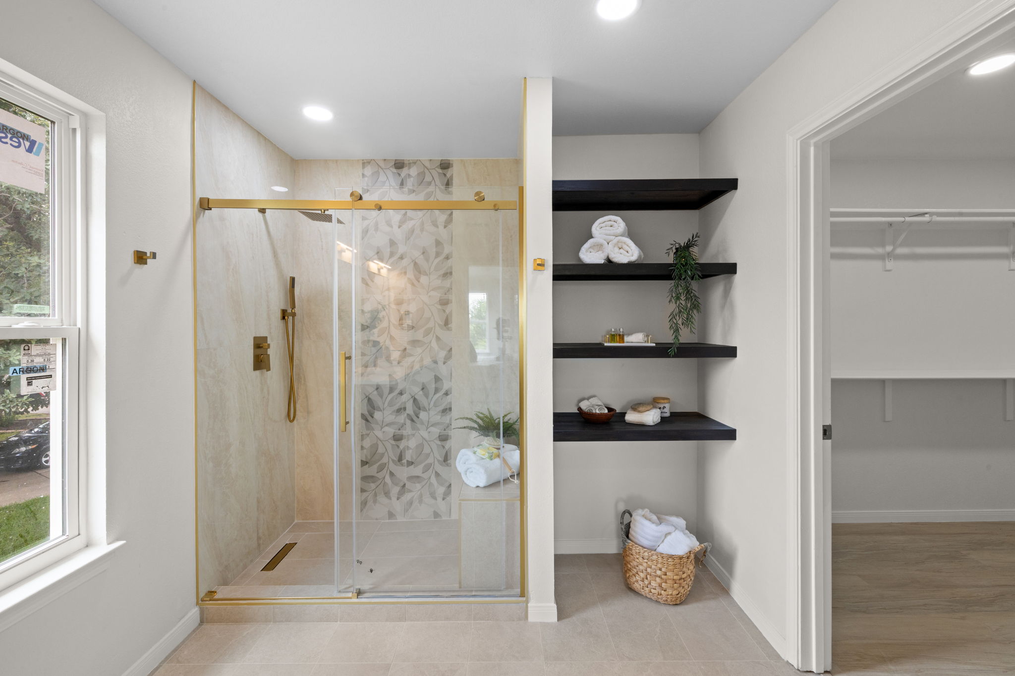 909 Rocking Spur Cove Pflugerville, TX 78660 - Photo 19 of 33 A lavish primary bathroom features an oversized walk-in shower, ample built-in storage, and direct access to a generous closet.