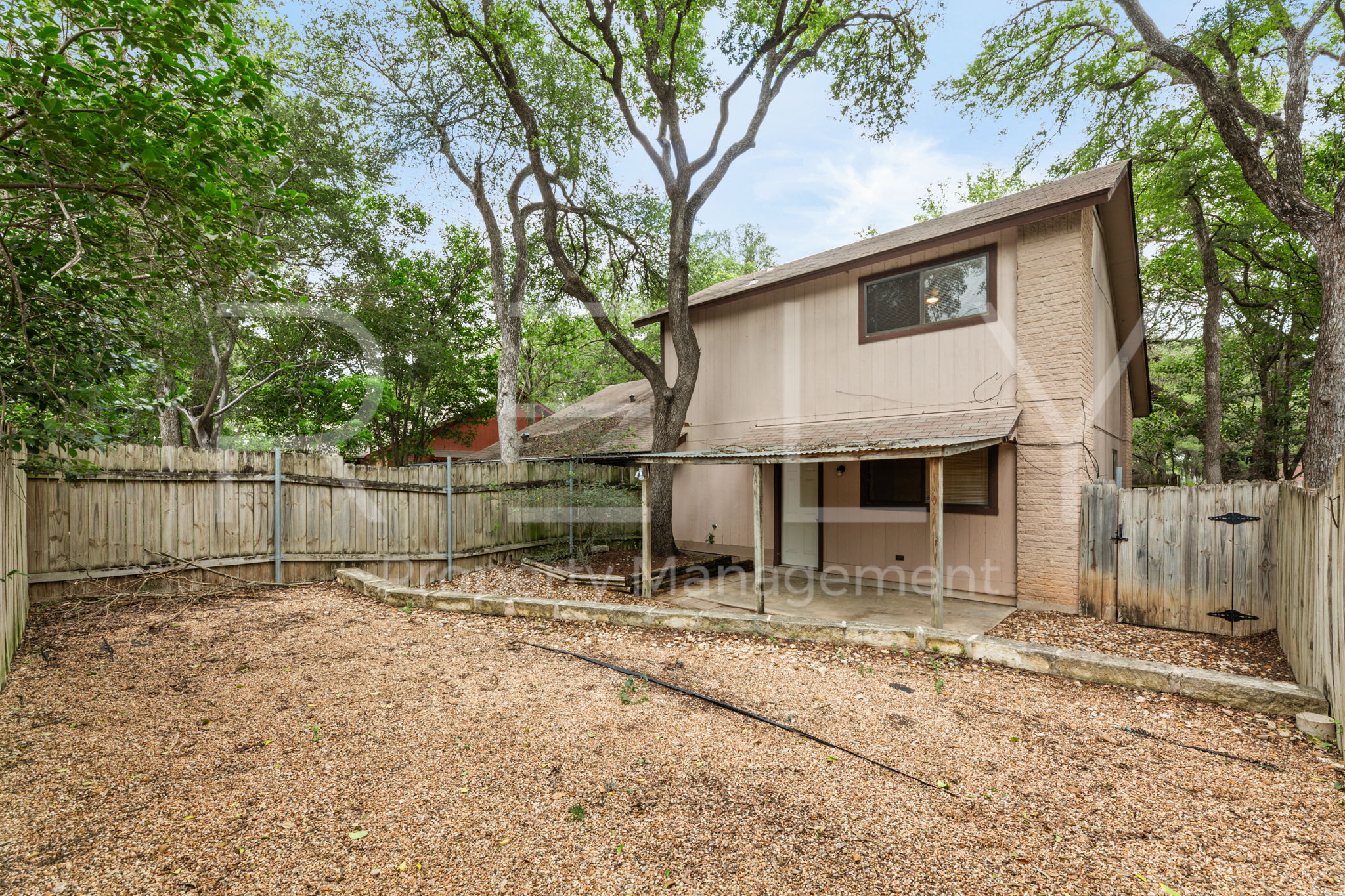1005 Milford Way, Unit A Austin, TX 78745 - Photo 29 of 30 a backyard of a house