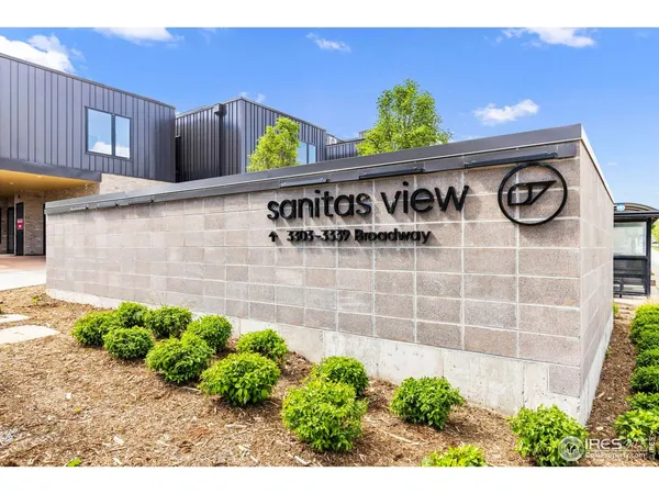 a view of house with outdoor space and mountain view