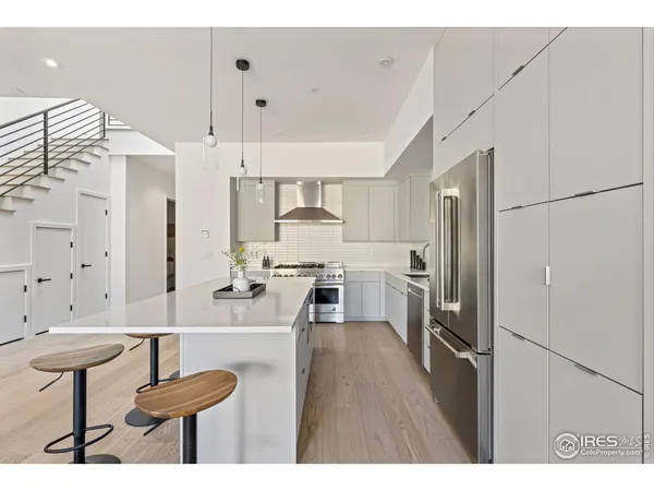 a stove top oven sitting inside of a kitchen