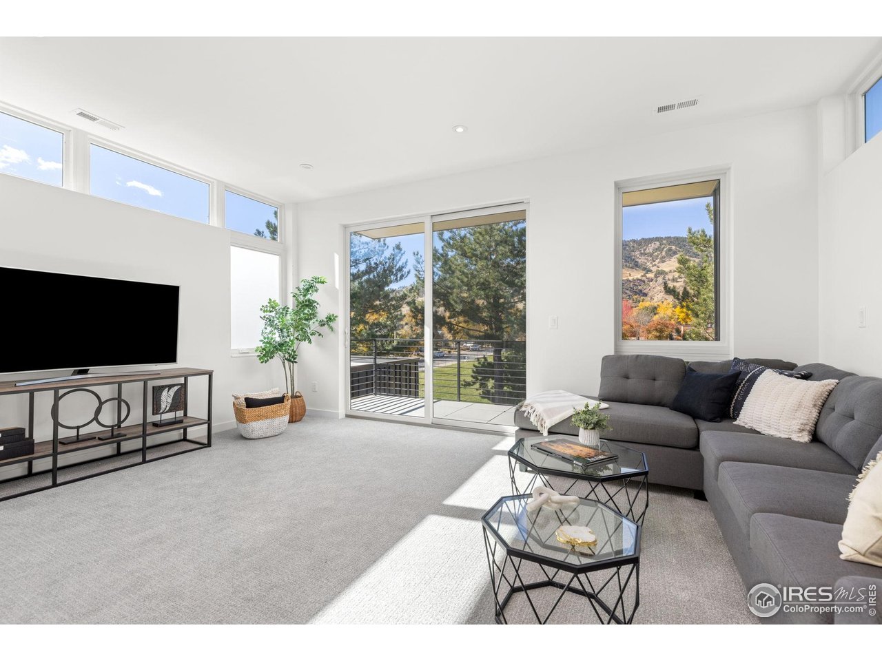 3319 Broadway Boulder, CO 80304 - Photo 20 of 38 a living room with furniture and a flat screen tv