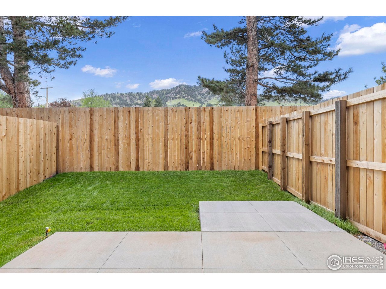 3319 Broadway Boulder, CO 80304 - Photo 23 of 38 a view of a backyard with wooden fence