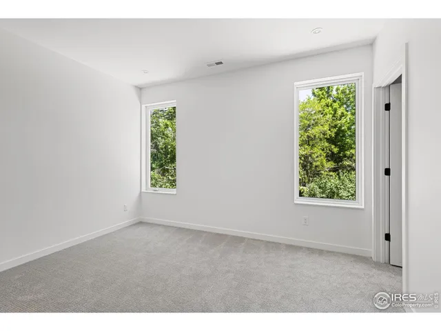 a work room with furniture and a window