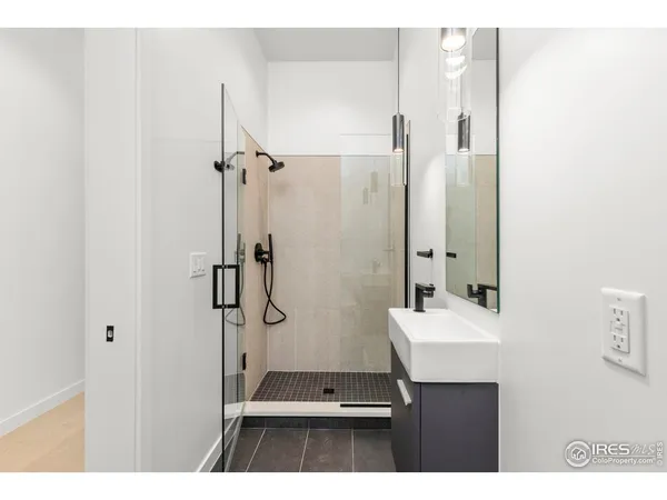 a bathroom with a sink and mirror