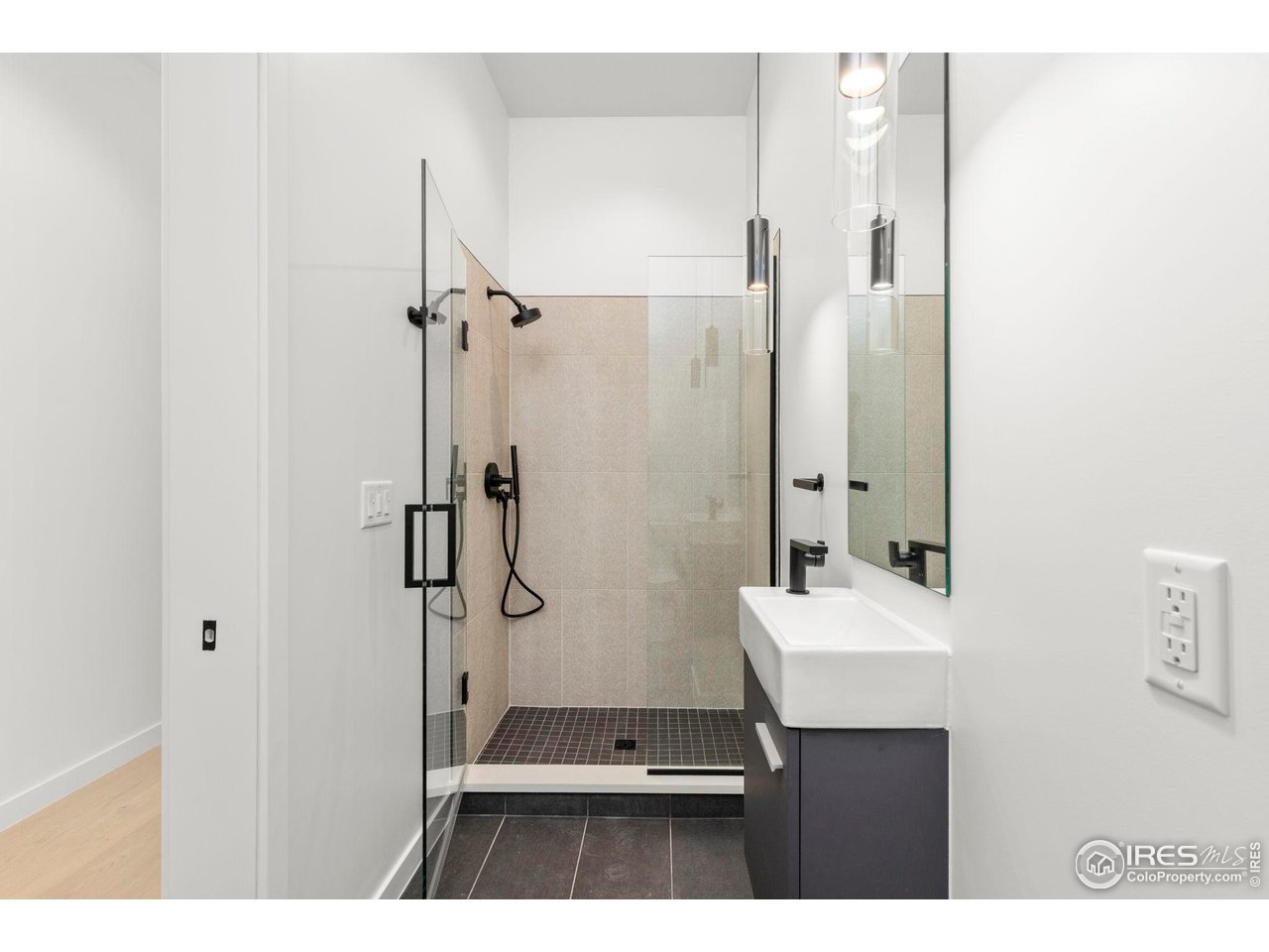 3319 Broadway Boulder, CO 80304 - Photo 36 of 38 a bathroom with a sink a toilet a mirror and shower