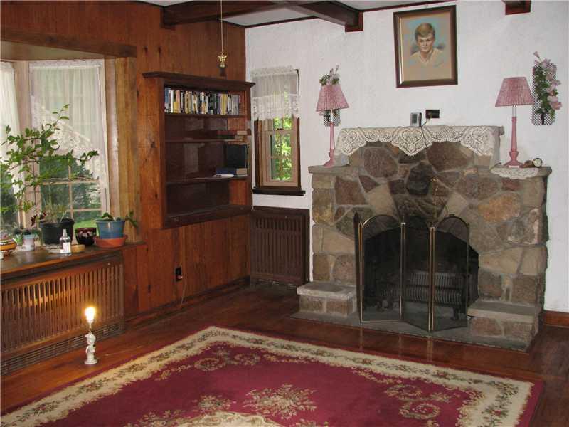 308 Teakwood Road Butler, PA 16001 - Photo 5 of 15 Living Room. stone fireplace, wood, new bay window, pine floors