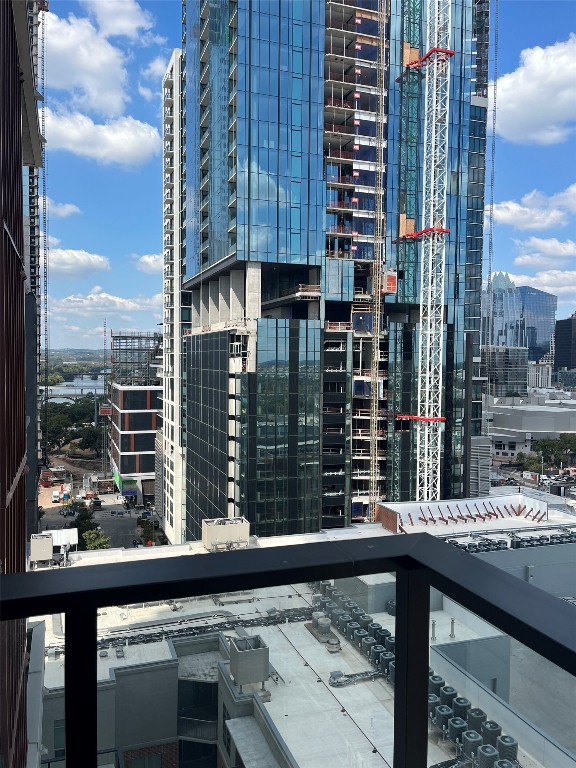 84 East Avenue, Unit 1502 Austin, TX 78701 - Photo 7 of 11 a view of a balcony with a couple of cars parked in parking area