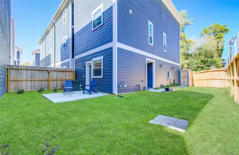 a view of backyard with a garden and deck