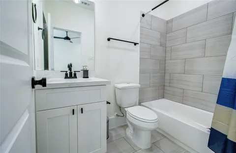 a bathroom with a sink a toilet and a bathtub
