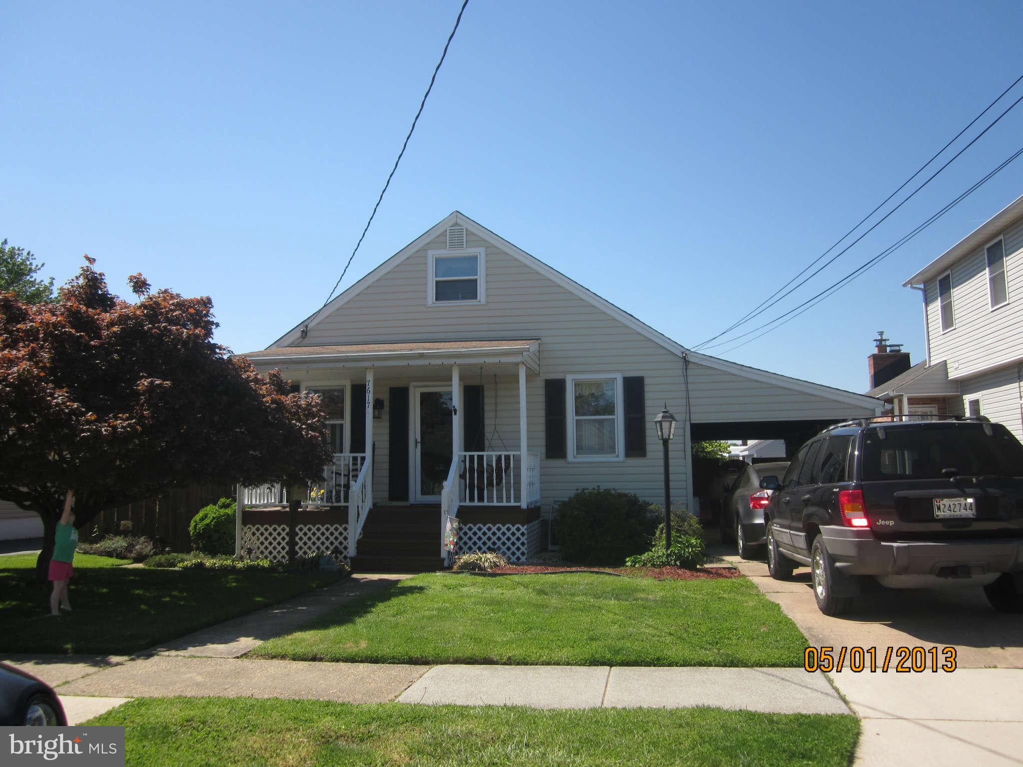 7617 Spruce Road Baltimore, MD 21222 - Photo 1 of 20 a front view of a house with a yard