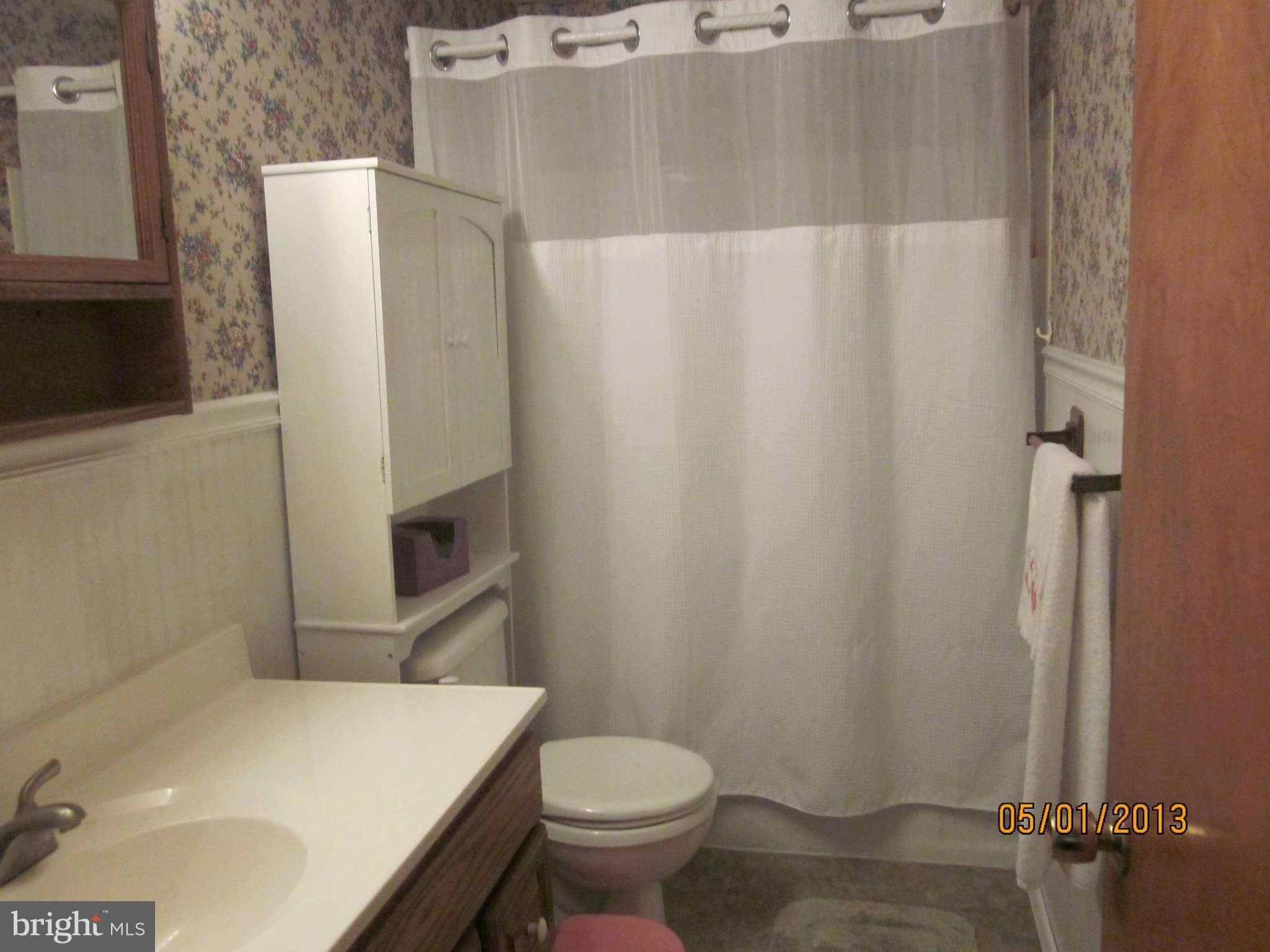 7617 Spruce Road Baltimore, MD 21222 - Photo 14 of 20 a bathroom with a sink and toilet