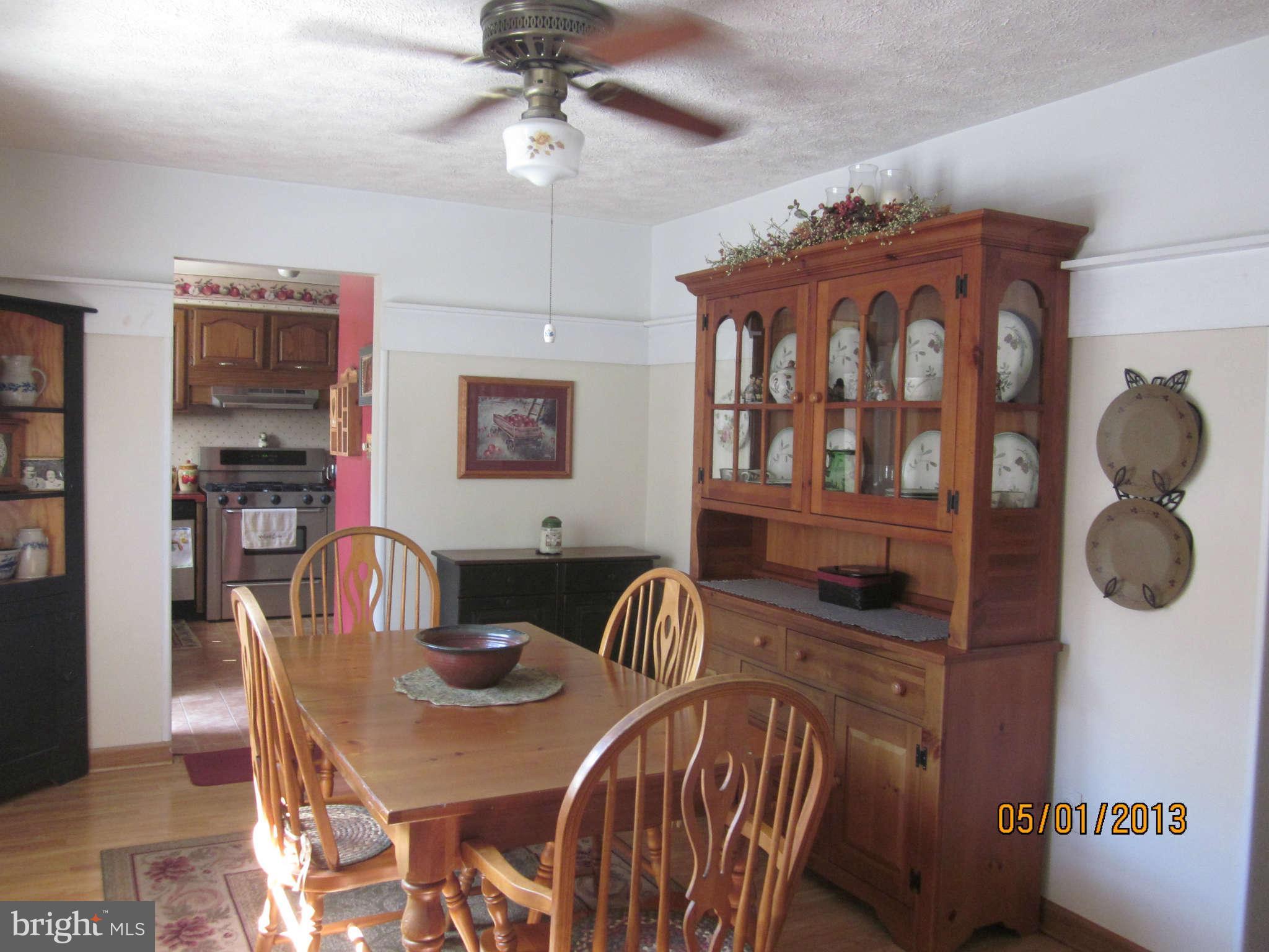 7617 Spruce Road Baltimore, MD 21222 - Photo 6 of 20 a dining room with furniture and window