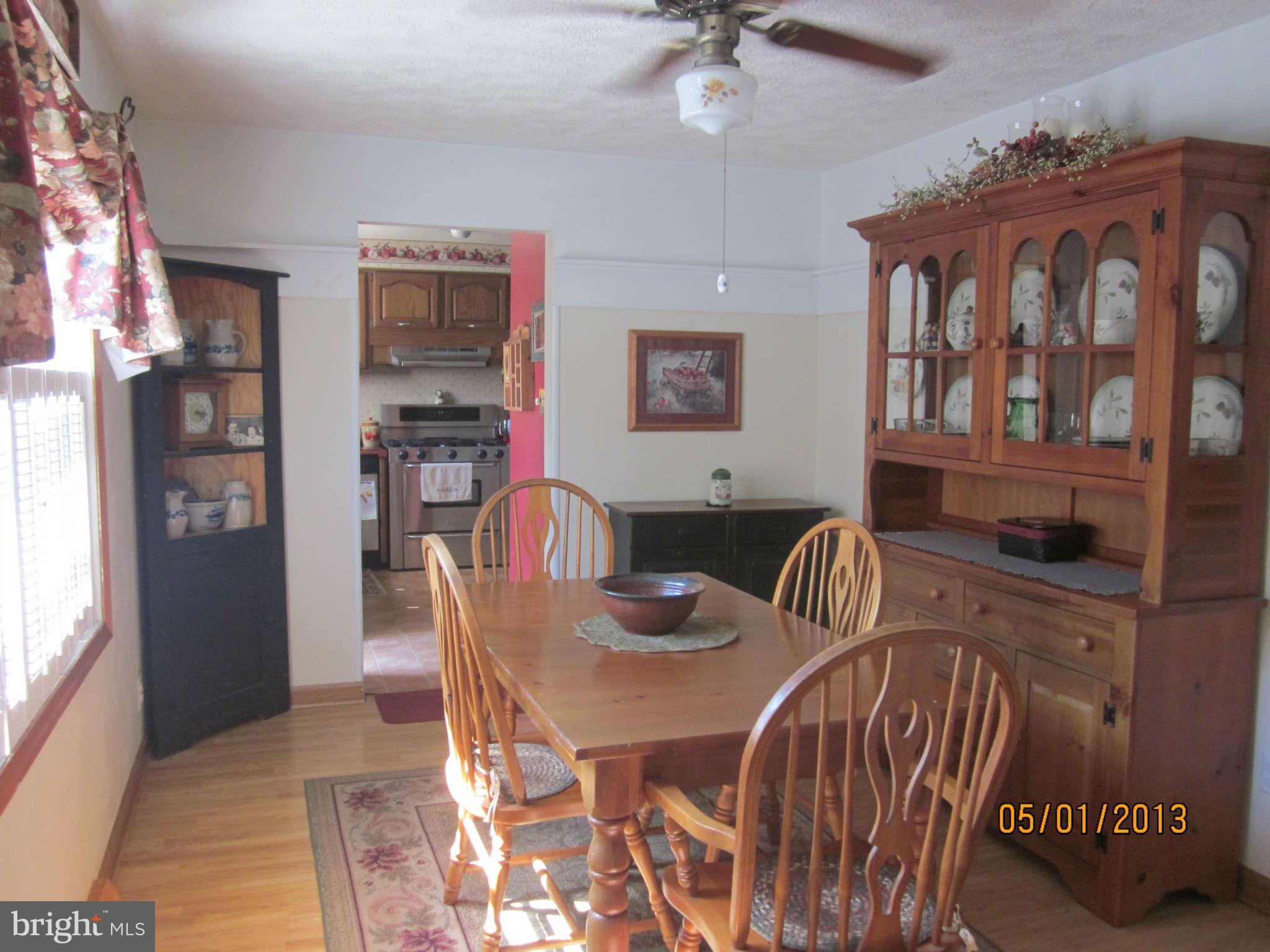 7617 Spruce Road Baltimore, MD 21222 - Photo 7 of 20 a dining room with furniture and window