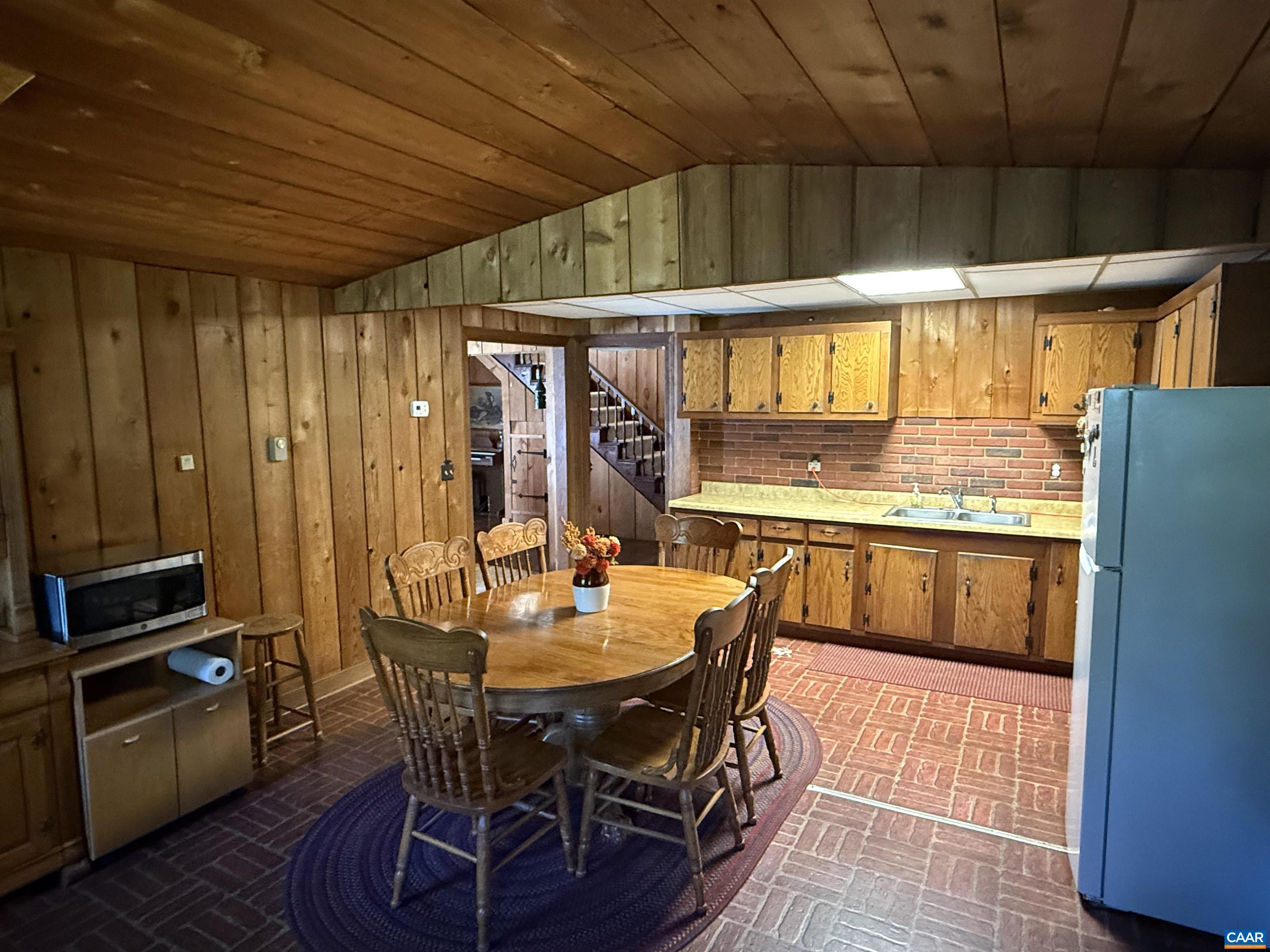 5609 New Line Road Gum Spring, VA 23065 - Photo 11 of 61 a dining table with chairs and window