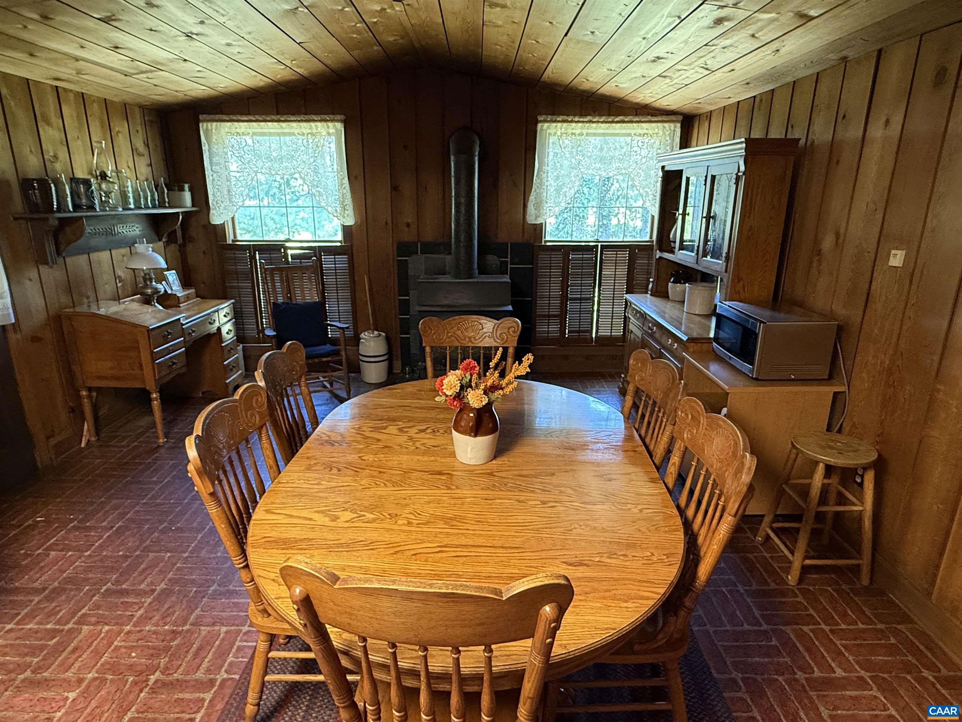 5609 New Line Road Gum Spring, VA 23065 - Photo 13 of 61 a view of a dining room with furniture window and outside view