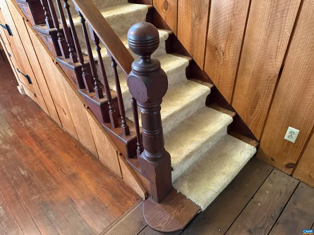 a bed room with a bed and a chair