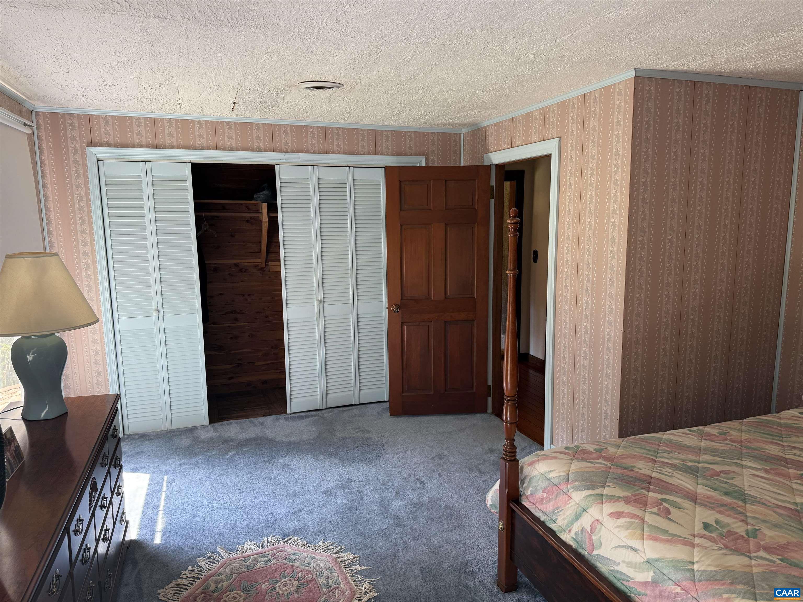 5609 New Line Road Gum Spring, VA 23065 - Photo 25 of 61 a bed room with a bed and a chair