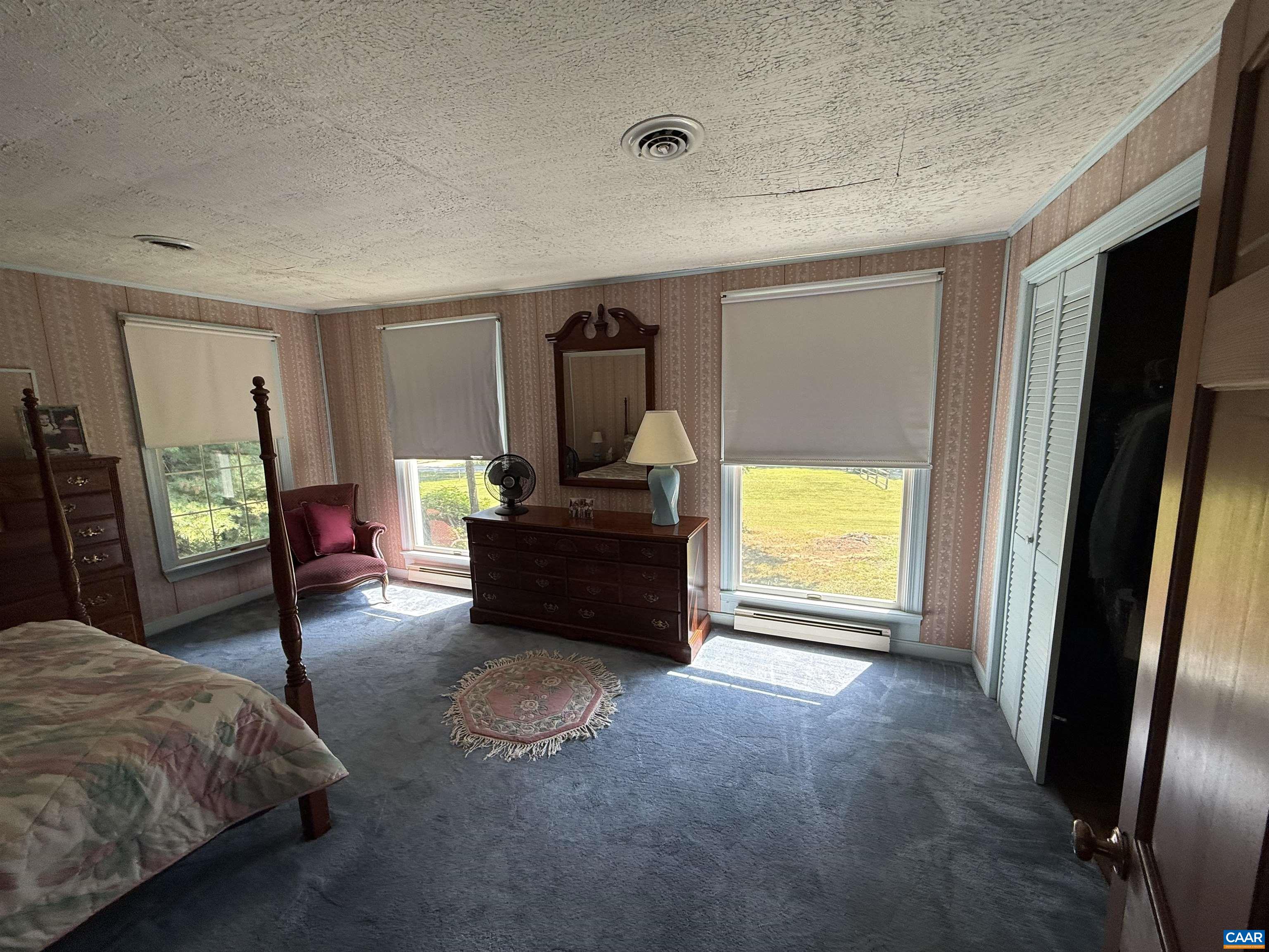 5609 New Line Road Gum Spring, VA 23065 - Photo 26 of 61 a spacious bedroom with a bed and a window