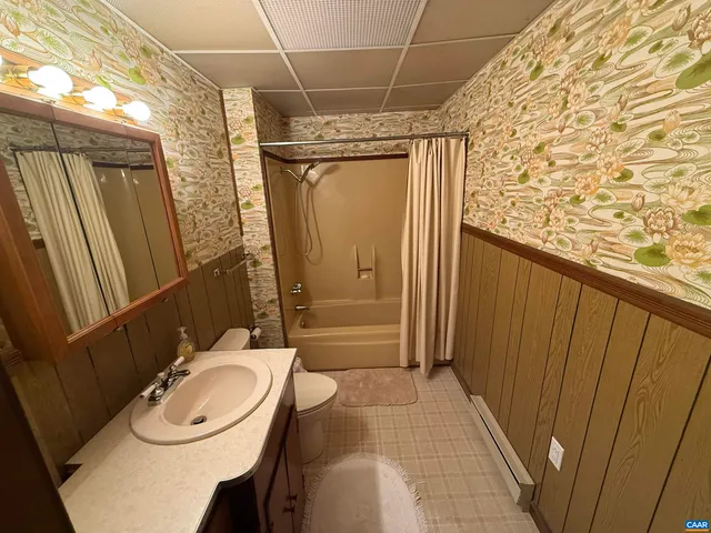 a front view of a building with trees