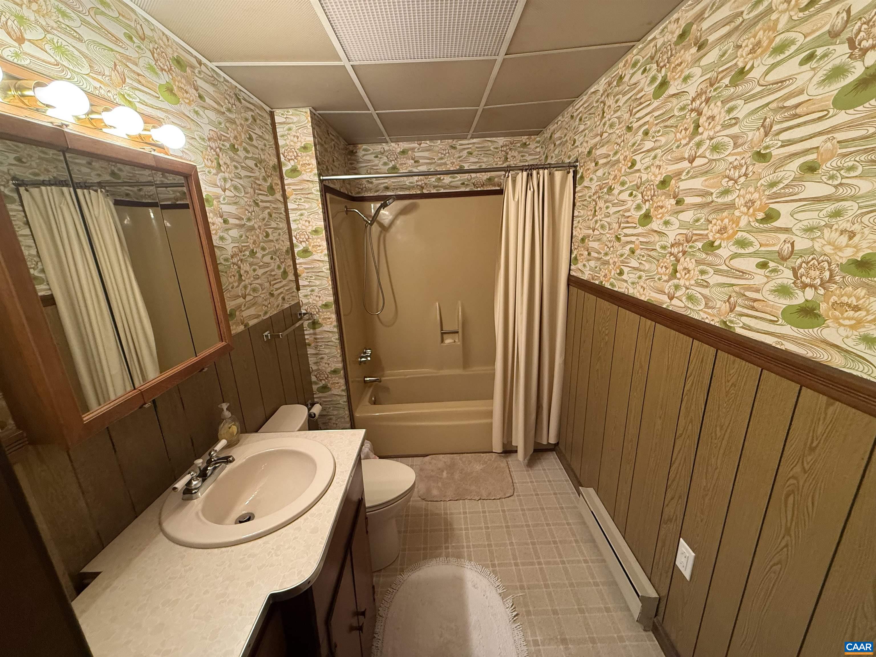 5609 New Line Road Gum Spring, VA 23065 - Photo 27 of 61 a bathroom with a granite countertop sink toilet and shower