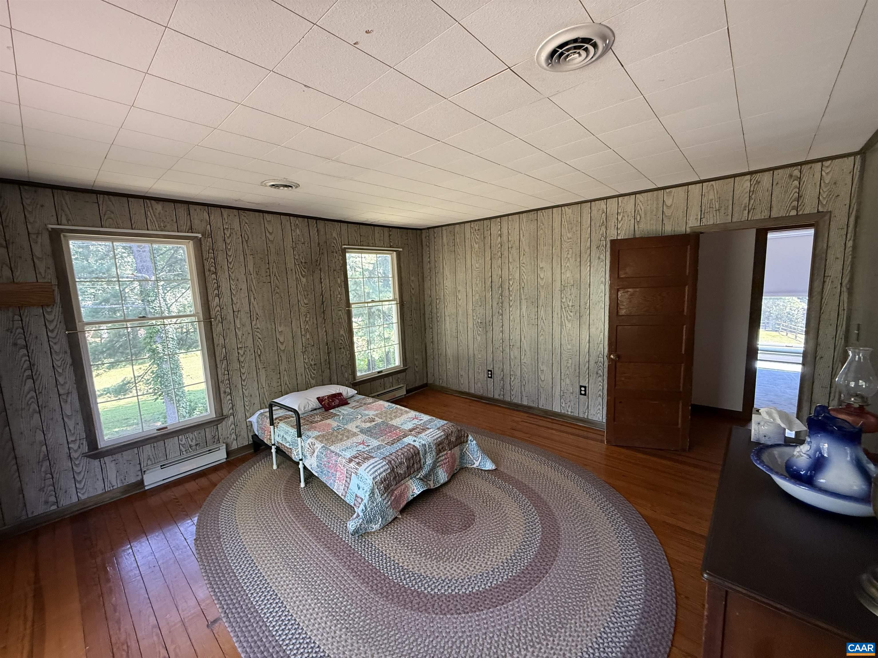 5609 New Line Road Gum Spring, VA 23065 - Photo 28 of 61 a living room with furniture and a flat screen tv