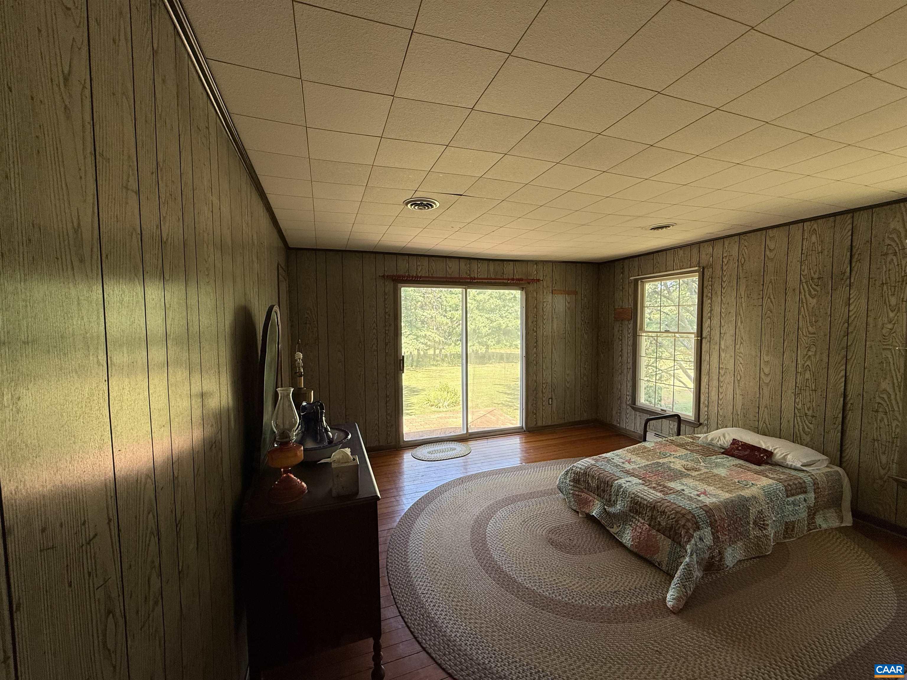 5609 New Line Road Gum Spring, VA 23065 - Photo 29 of 61 a bed sitting in a spacious bedroom next to a window