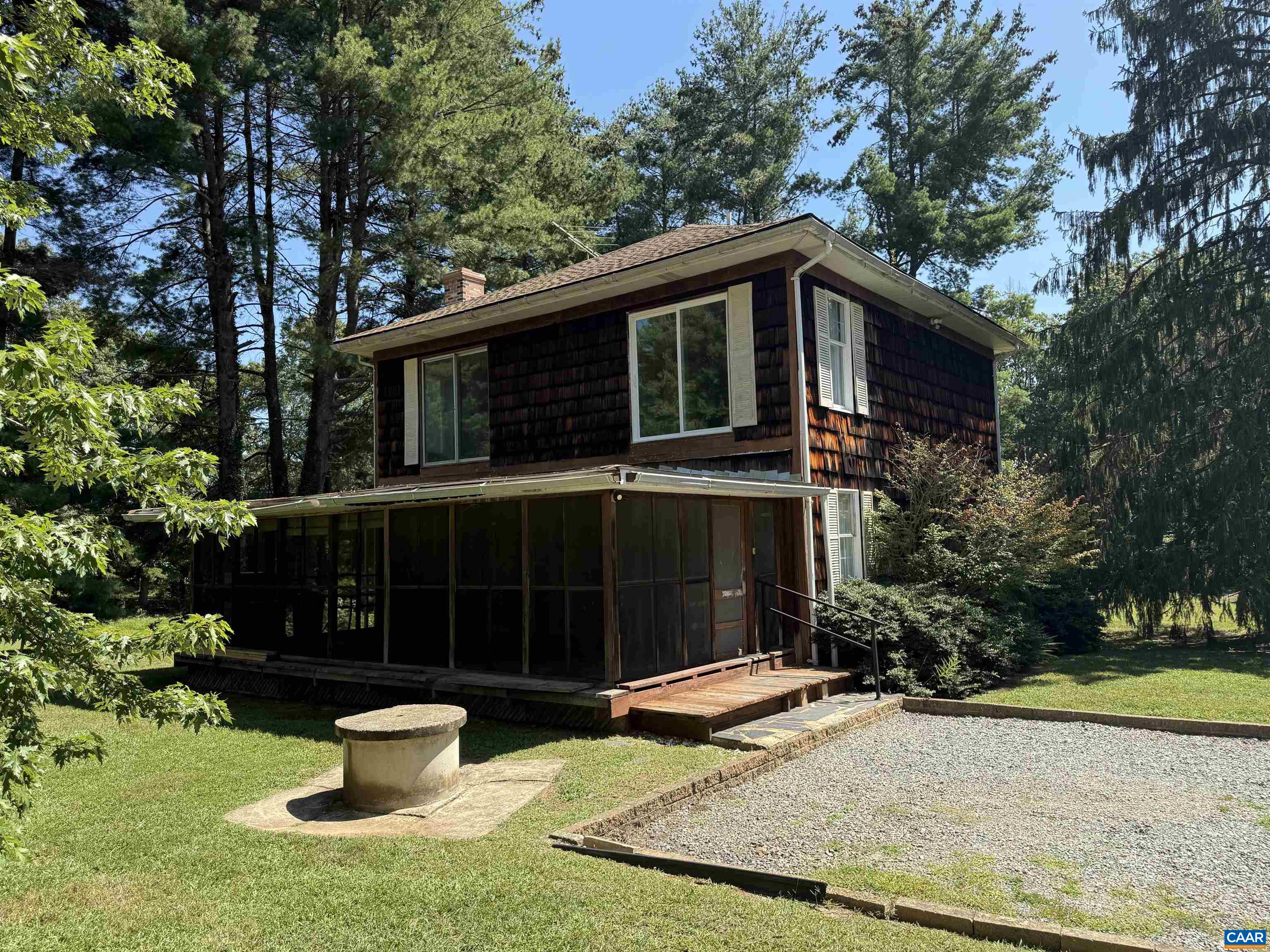 5609 New Line Road Gum Spring, VA 23065 - Photo 34 of 61 a view of a house with a yard and potted plants