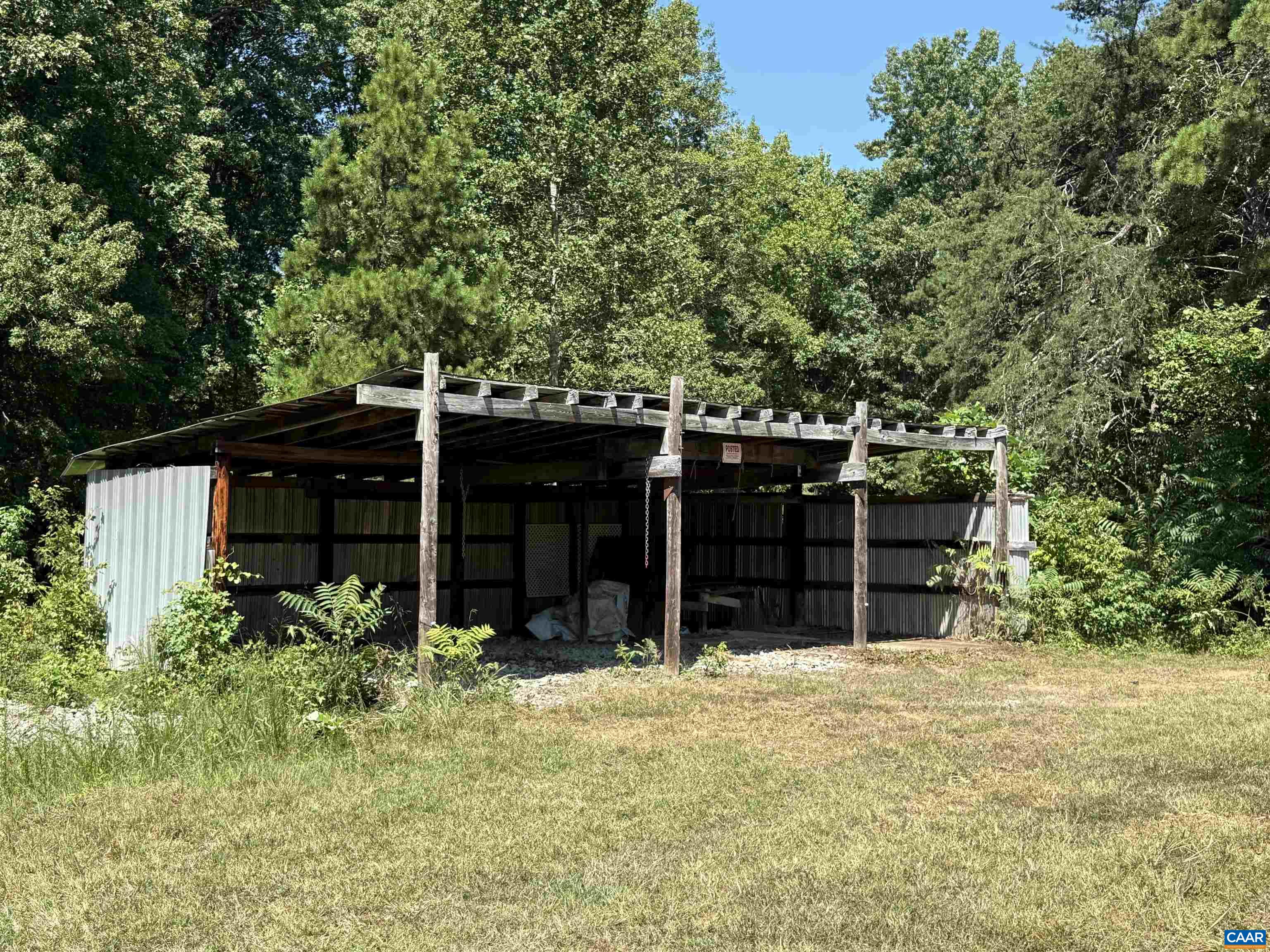 5609 New Line Road Gum Spring, VA 23065 - Photo 43 of 61 a view of a house with a large window and yard