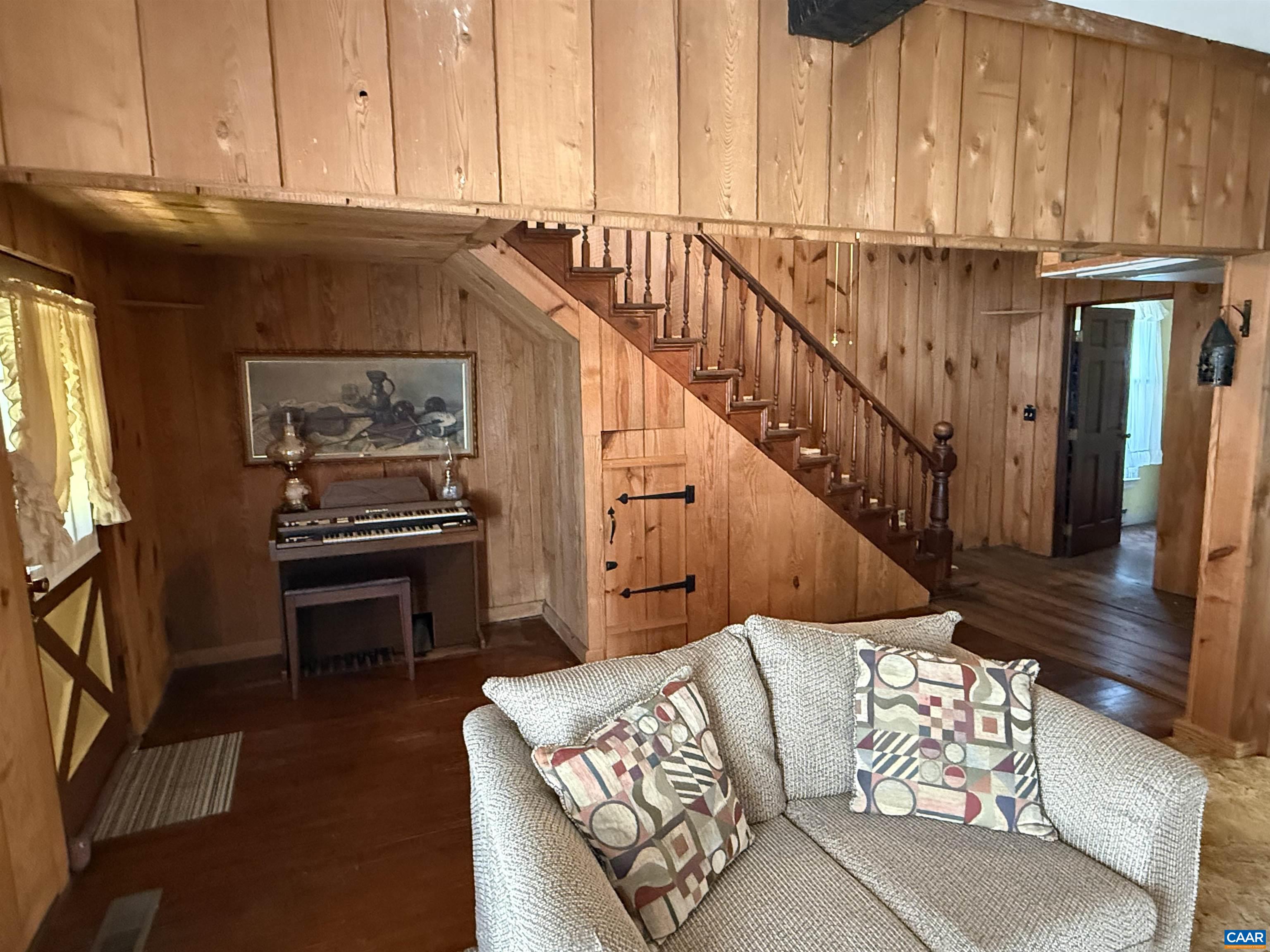 5609 New Line Road Gum Spring, VA 23065 - Photo 5 of 61 a living room with wooden floor furniture and a fireplace