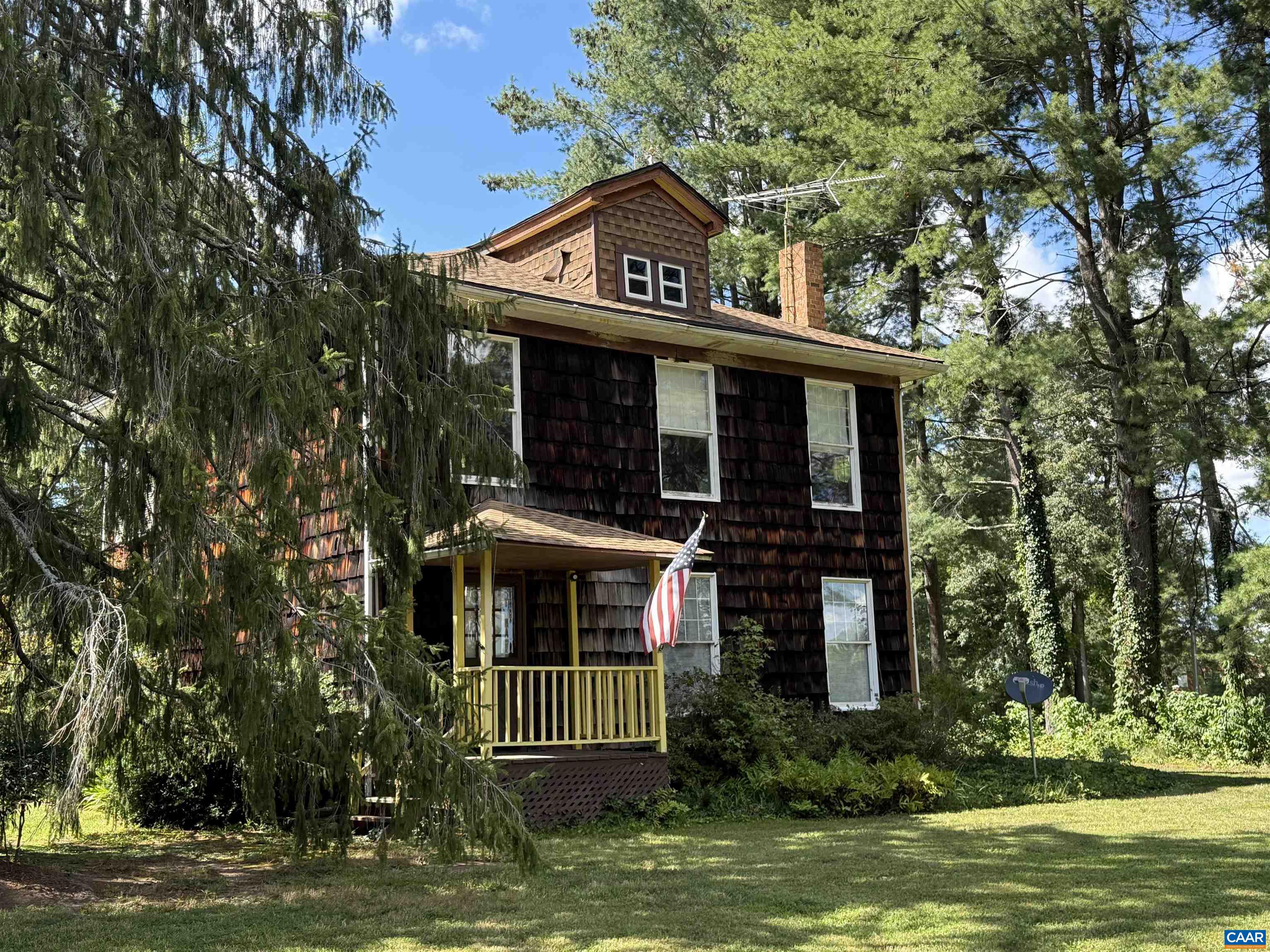5609 New Line Road Gum Spring, VA 23065 - Photo 51 of 61 a view of a house with a small yard plants and large tree